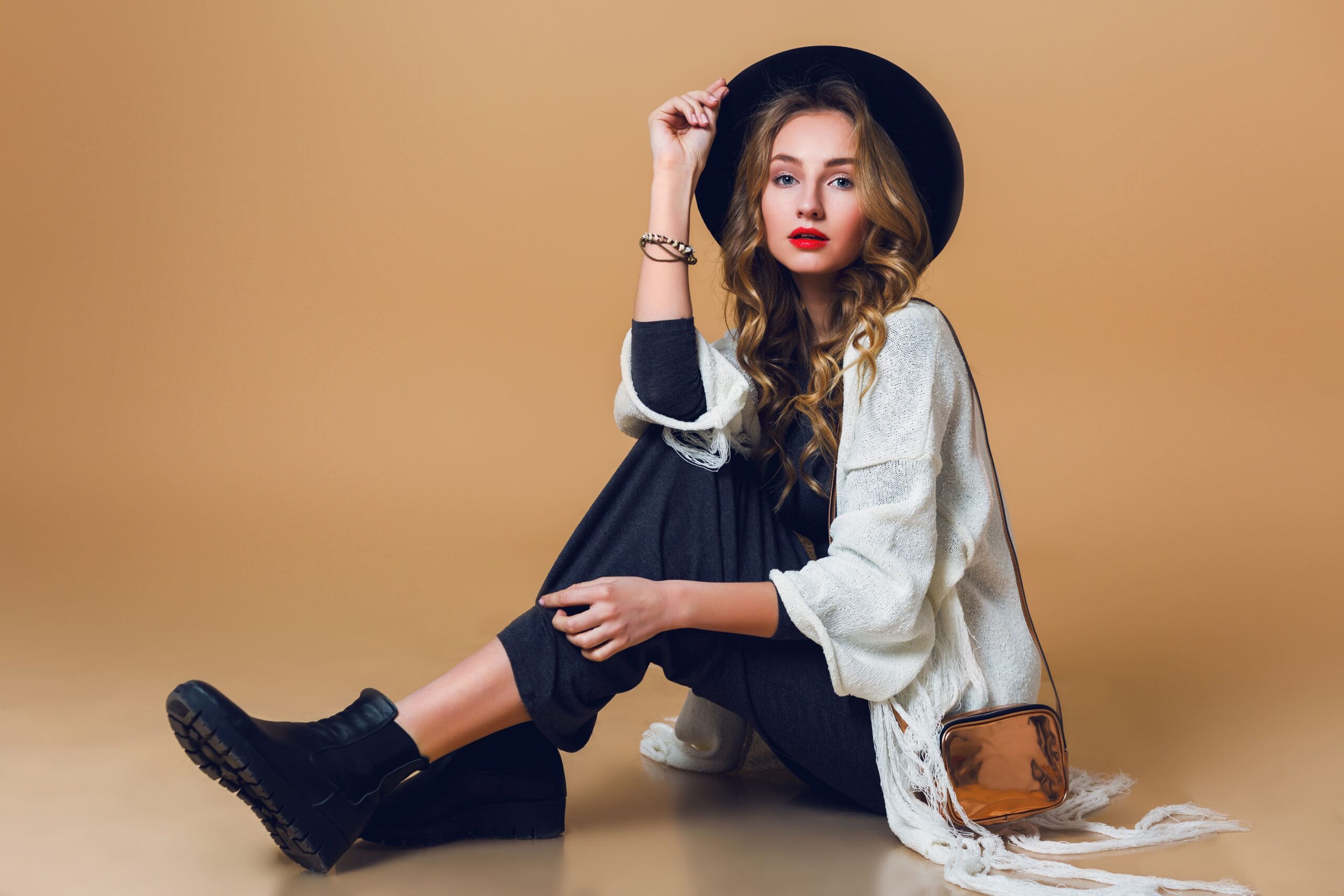 high-fashion-portrait-young-elegant-blonde-woman-black-wool-hat-wearing-oversize-white-fringe-poncho-with-long-grey-dress (1)